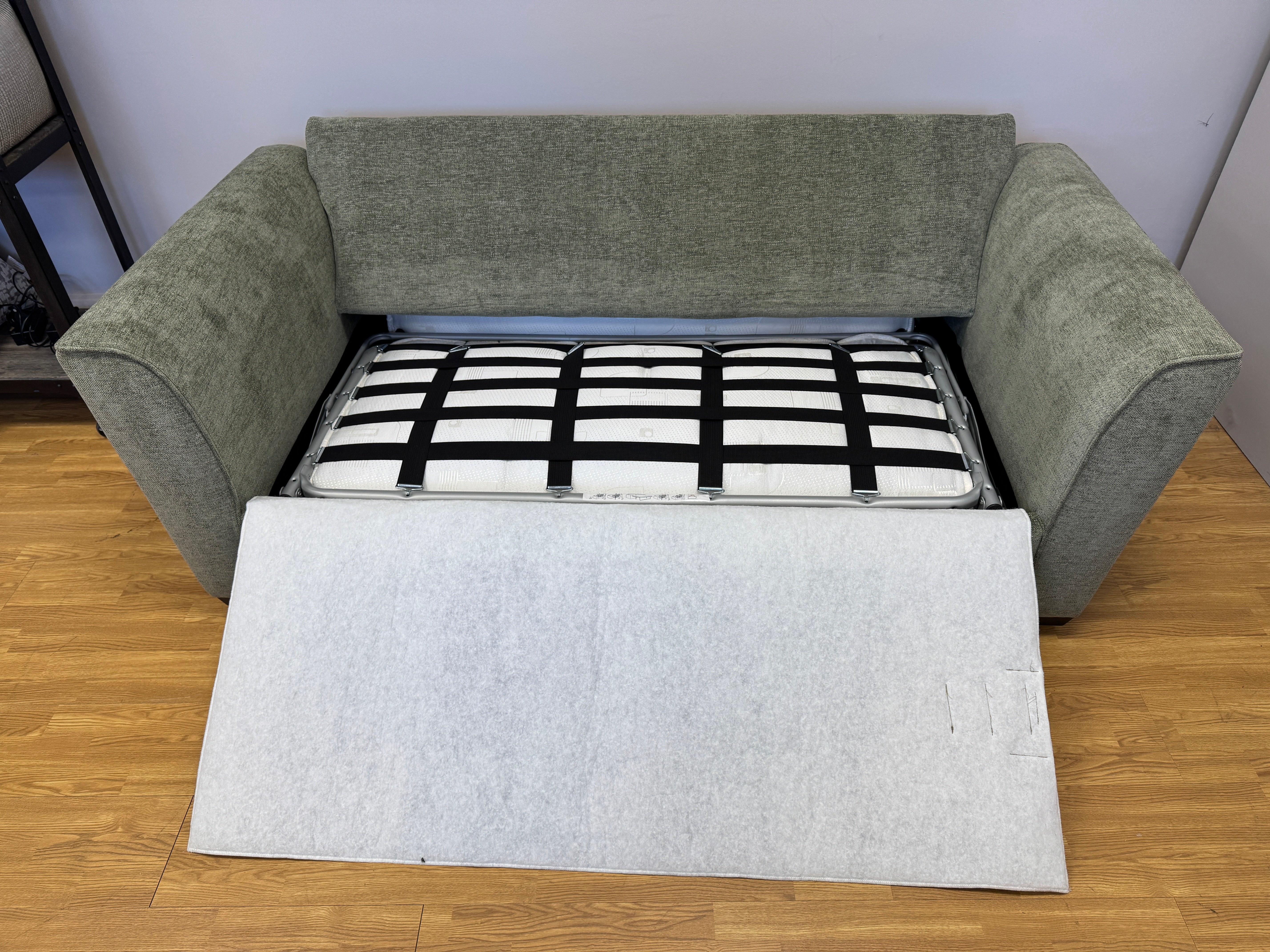 Caspian 3 seater sofa bed in Marlon Botanic green fabric