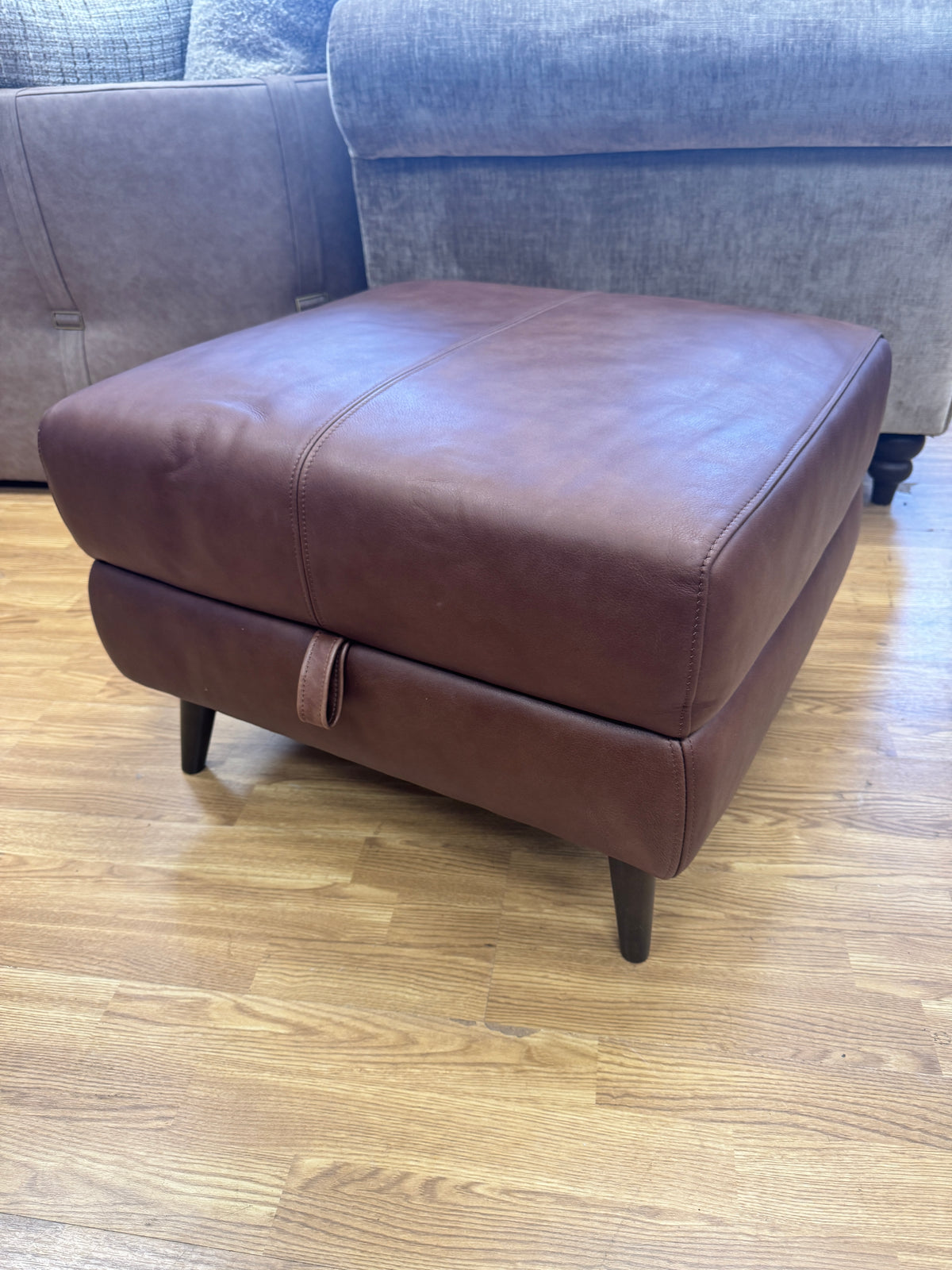 Adler storage footstool in soft tan brown leather