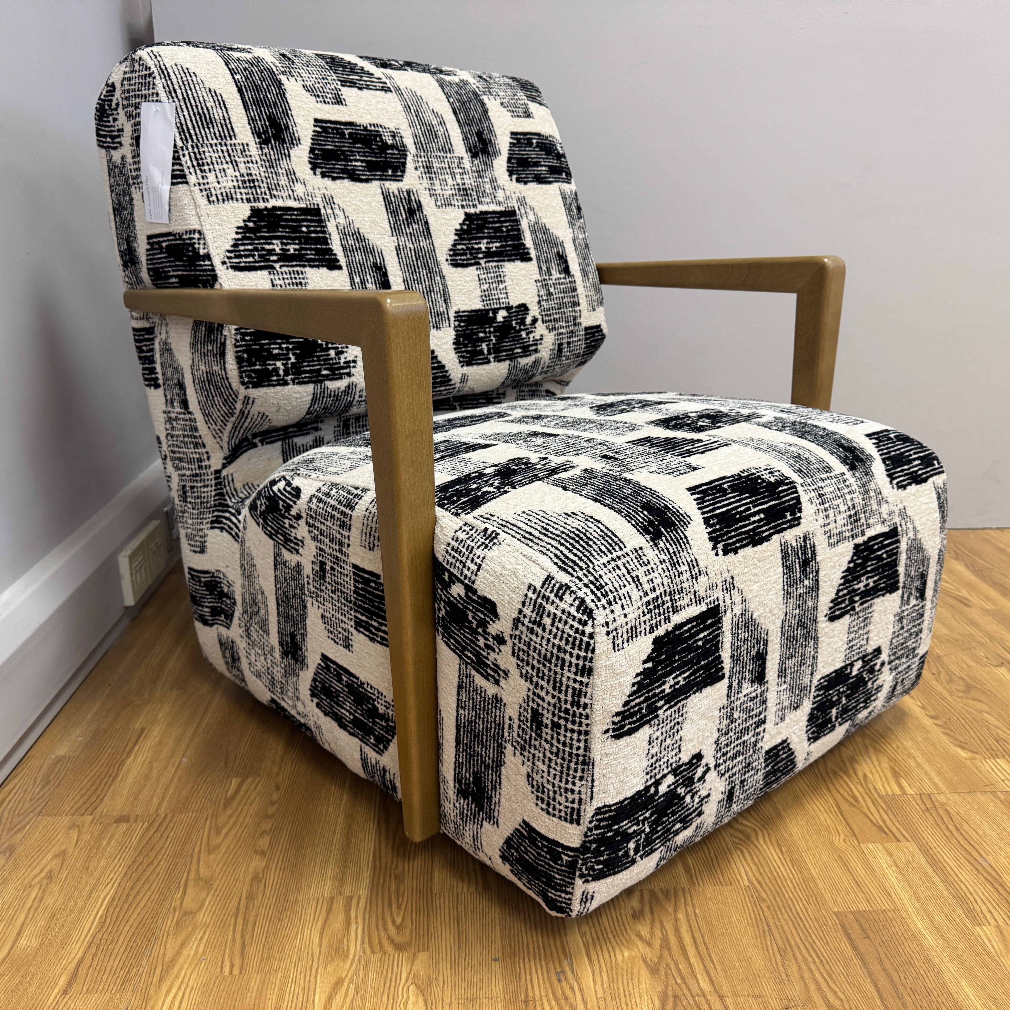 Lyla accent chair with swivel base and wooden arms in Maverick mono velvet fabric