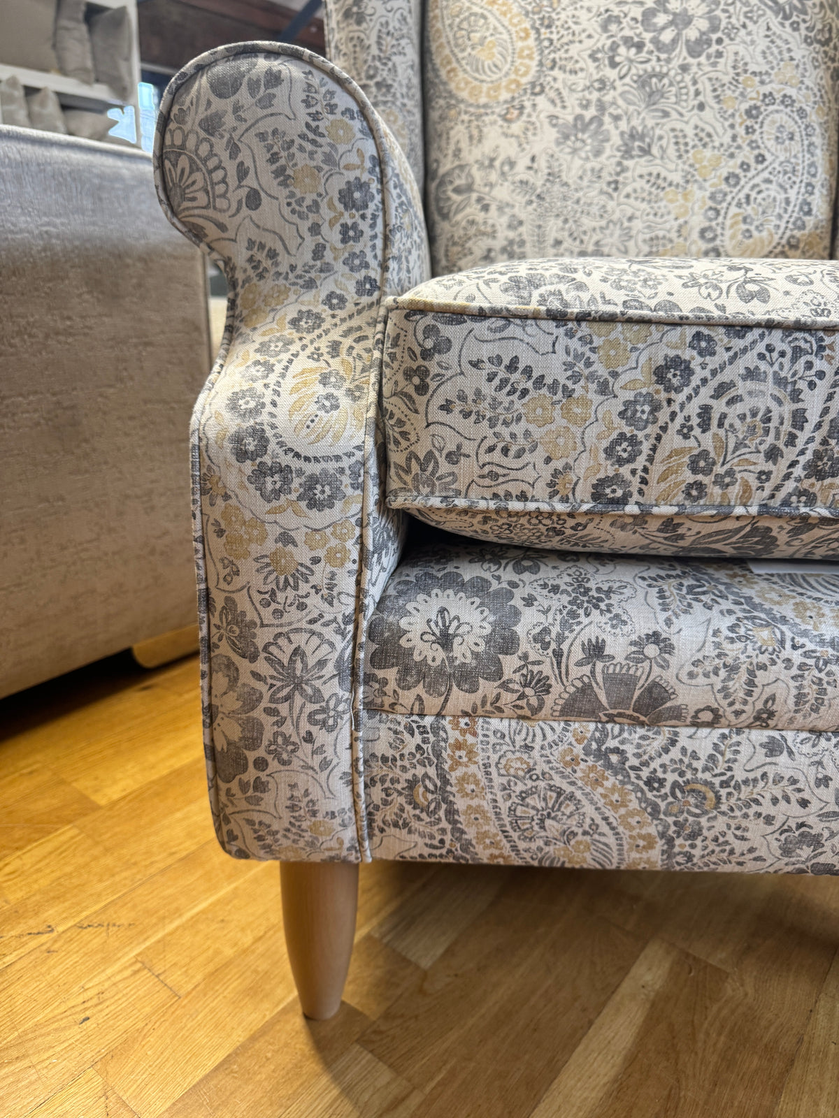 Heather wingback accent chair in grey / ochre Paisley print fabric