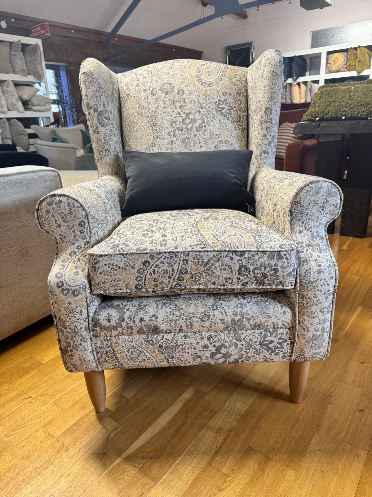 Heather wingback accent chair in grey / ochre Paisley print fabric