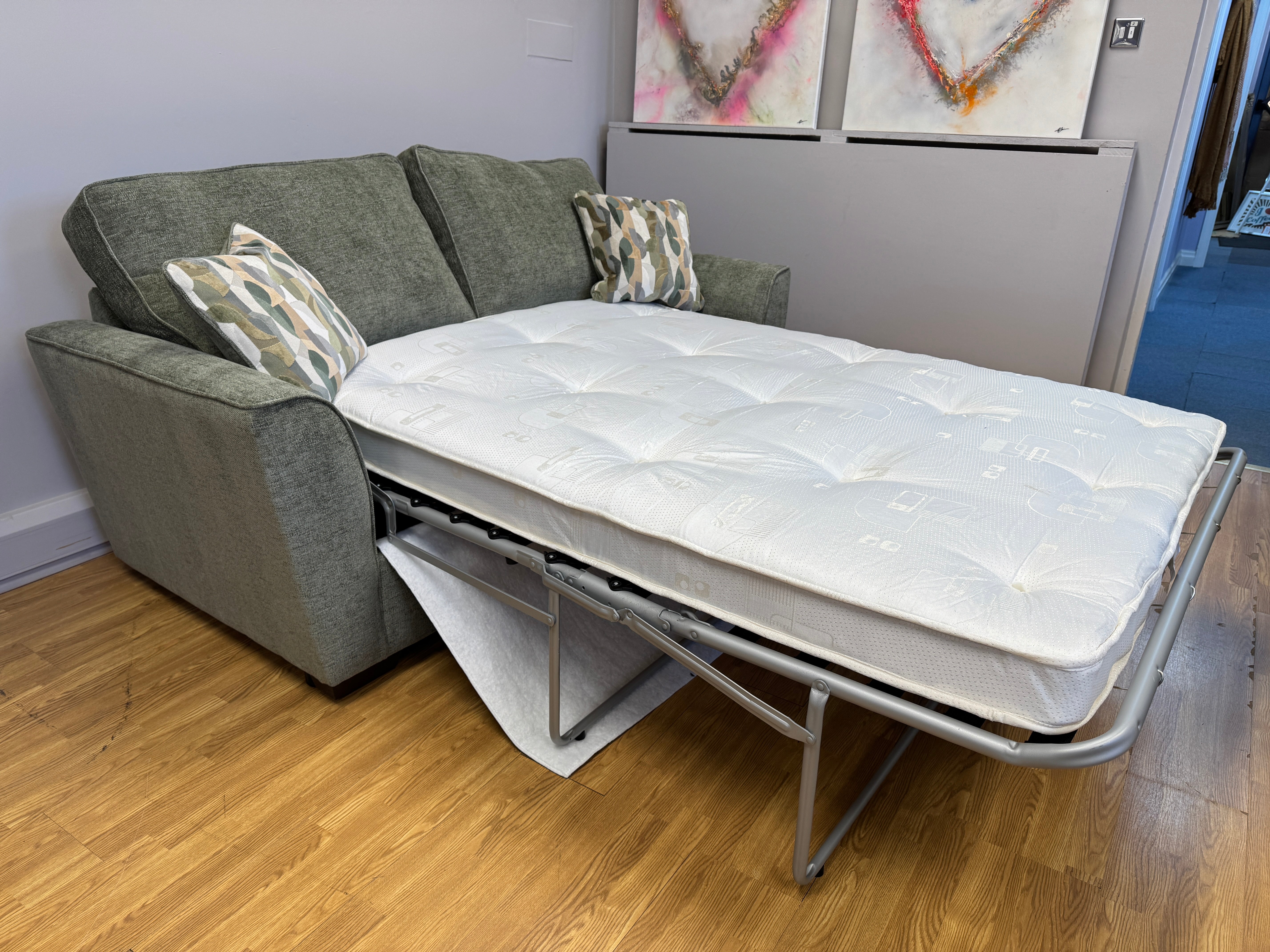 Caspian 3 seater sofa bed in Marlon Botanic green fabric