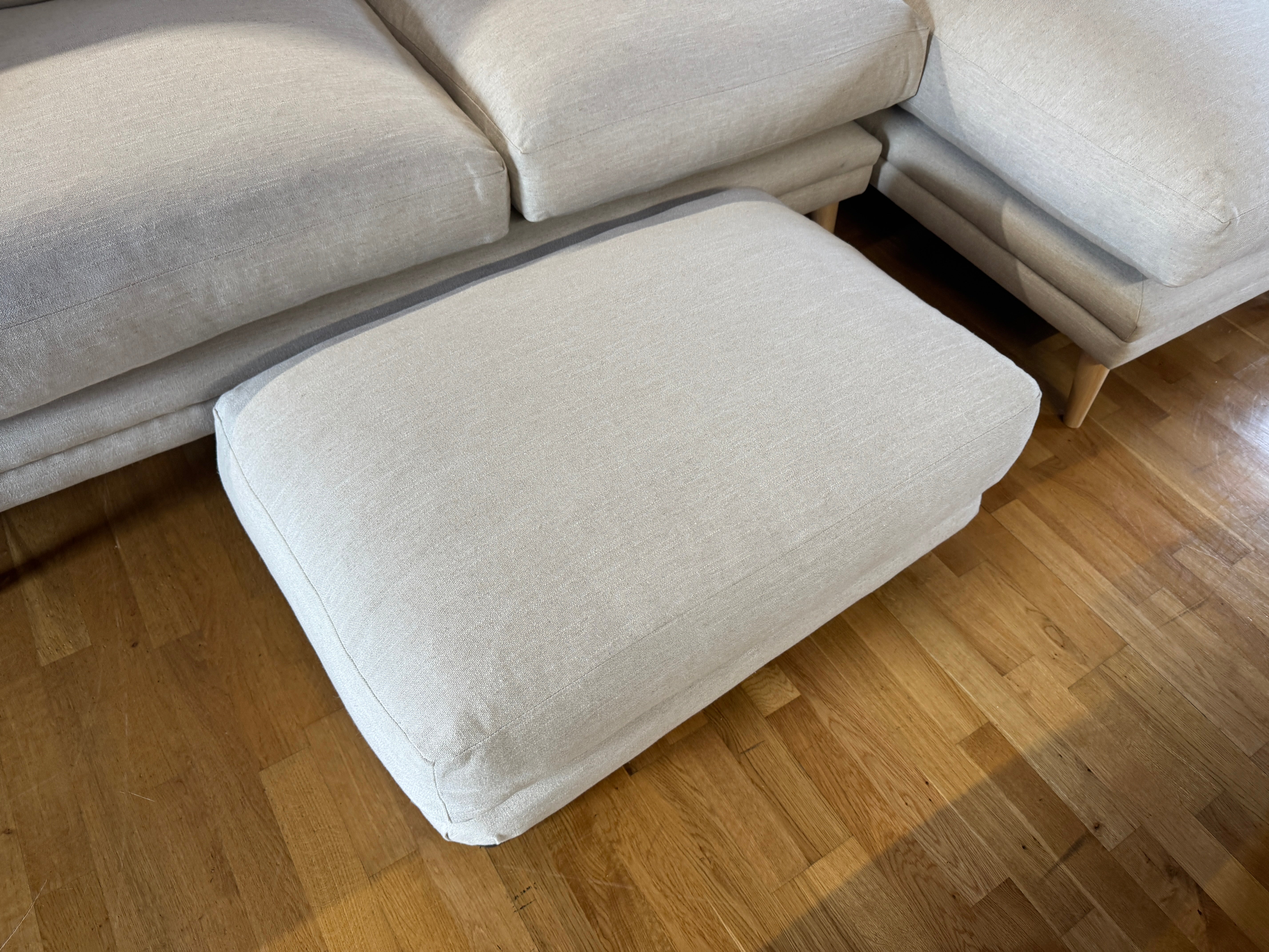 Loaf padded top footstool in clever vintage linen