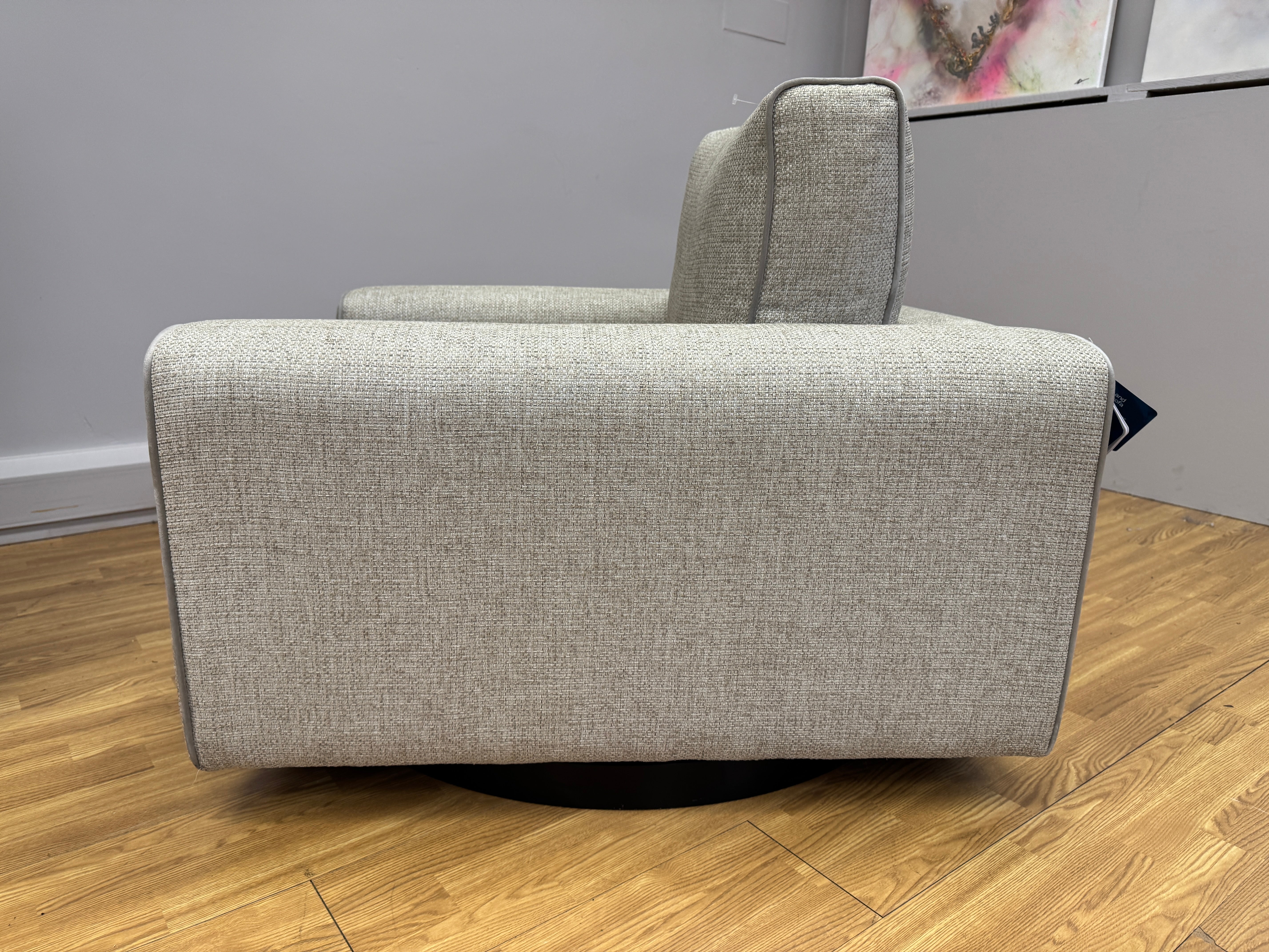 Sofology Stirling armchair on swivel base in chunky woven stone fabric