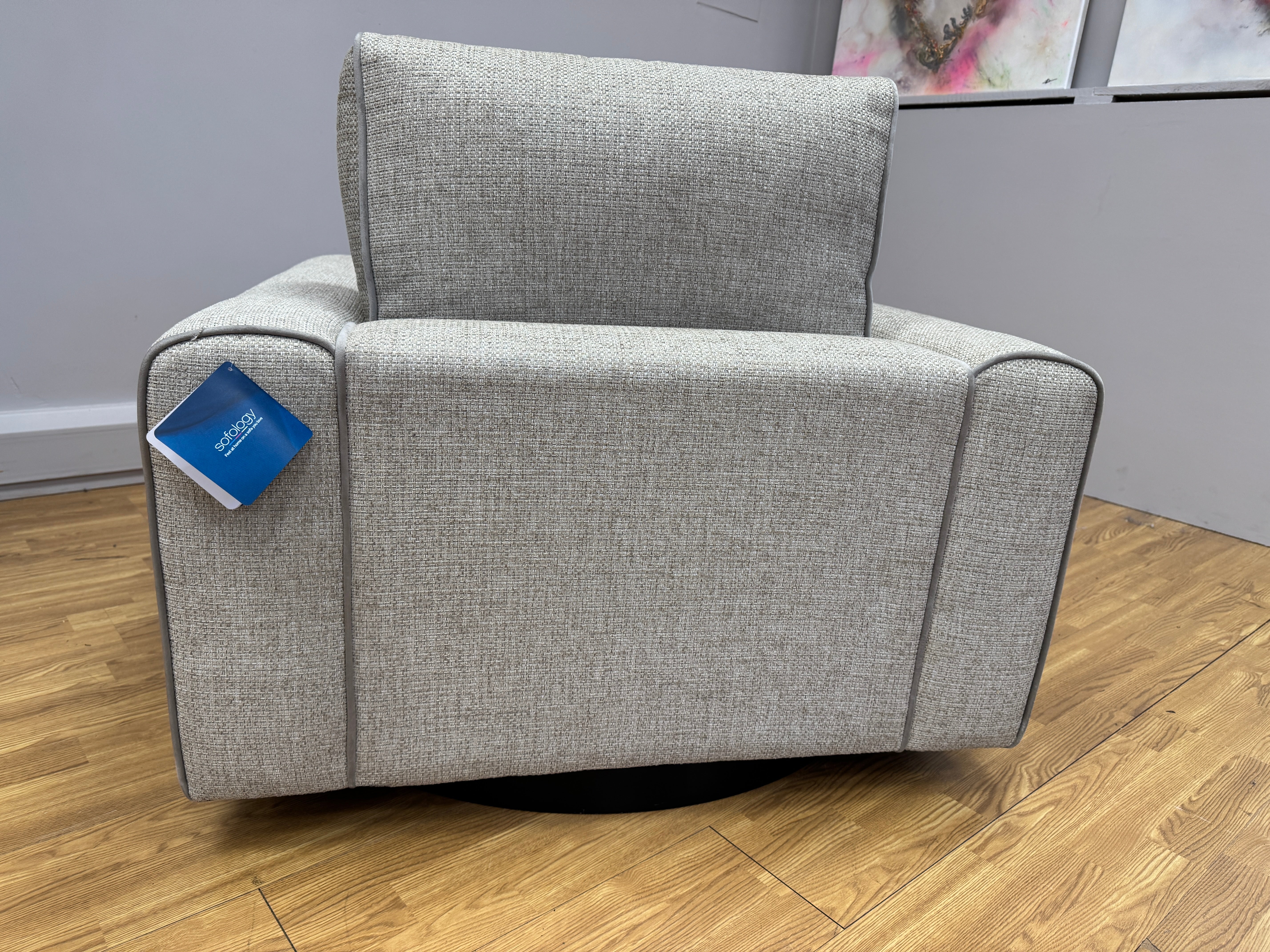 Sofology Stirling armchair on swivel base in chunky woven stone fabric