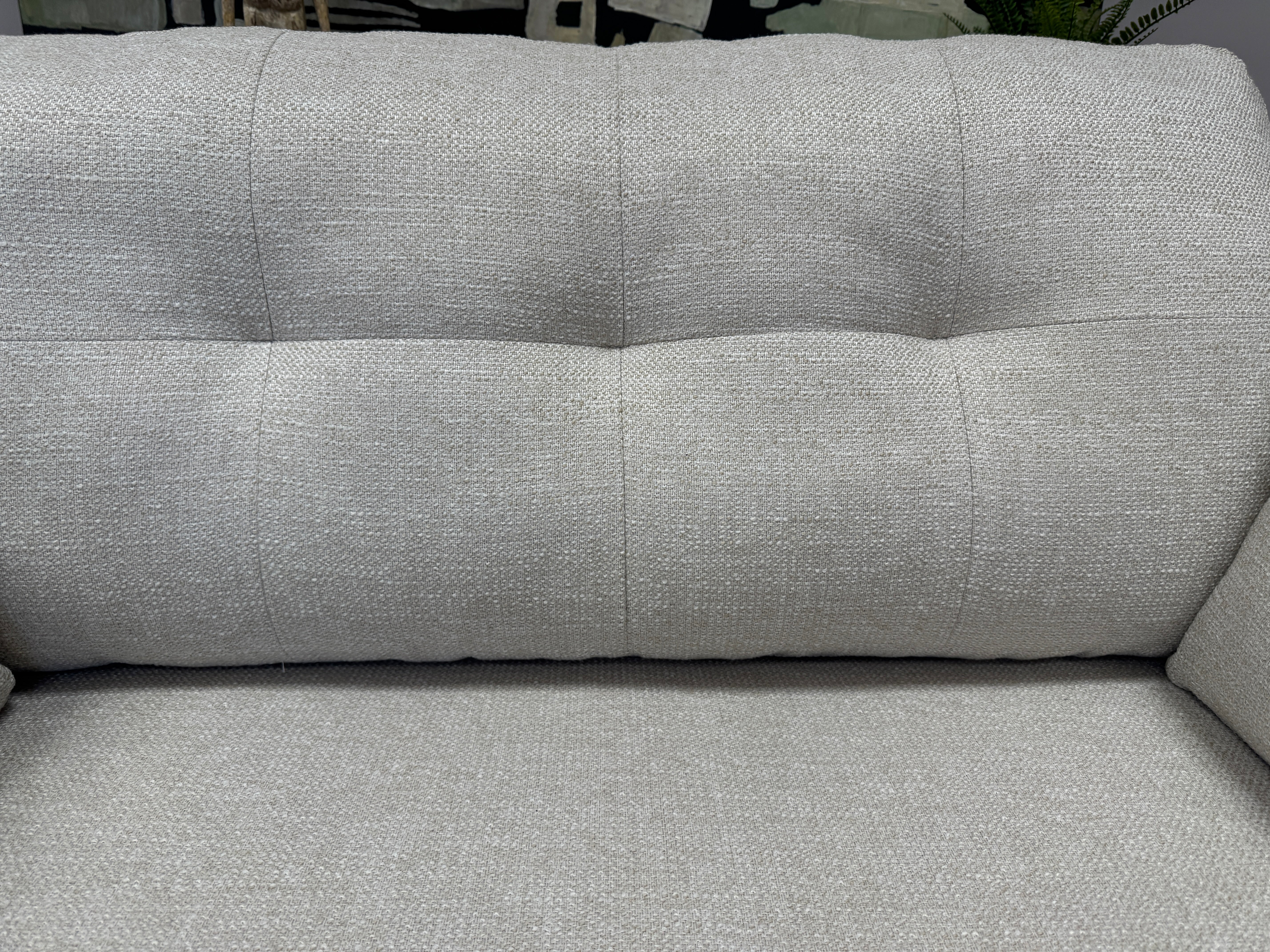 Lottie curved sided loveseat in natural soft weave fabric