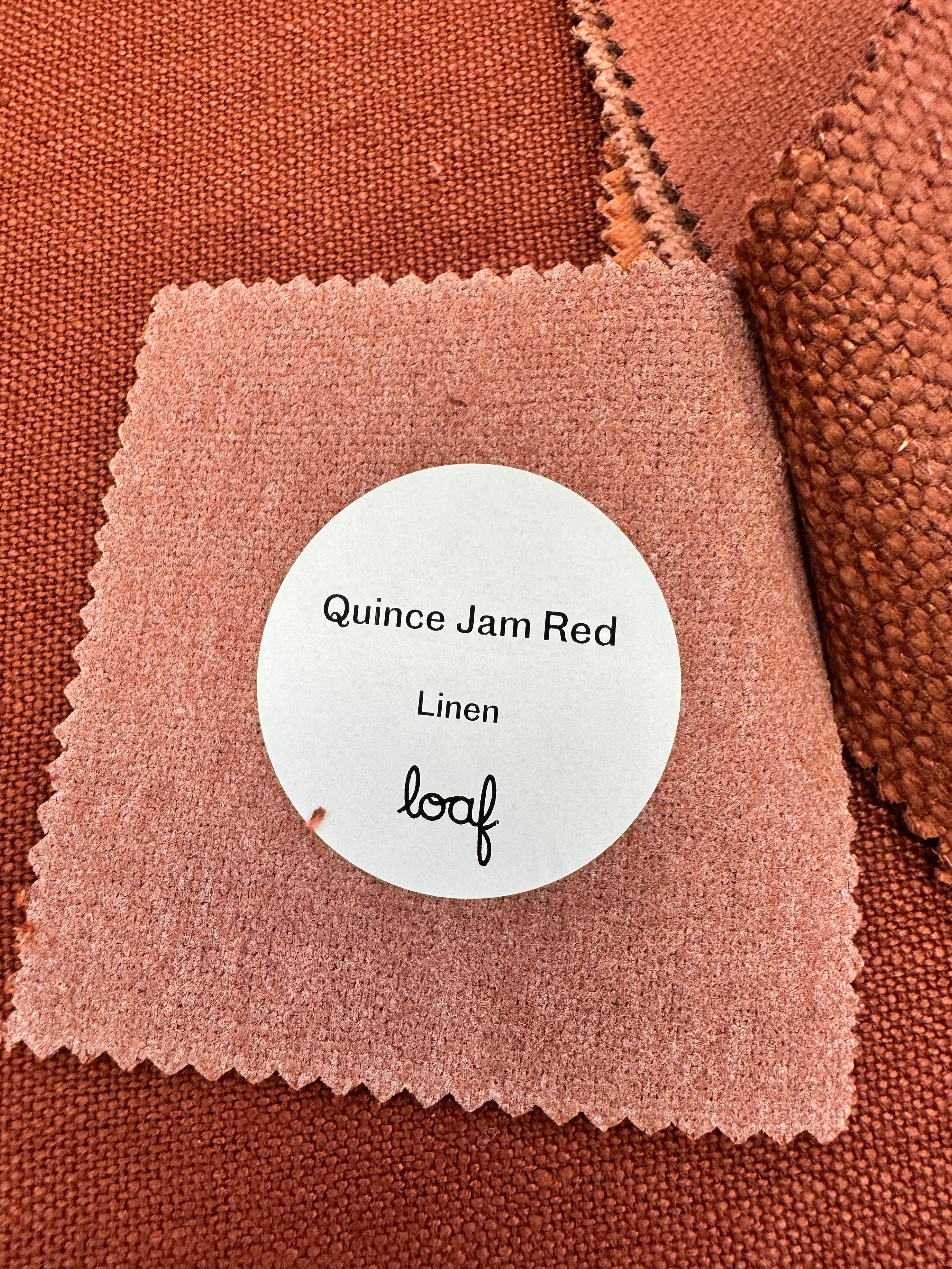 Pudding Loveseat in Quince Jam Red Linen fabric
