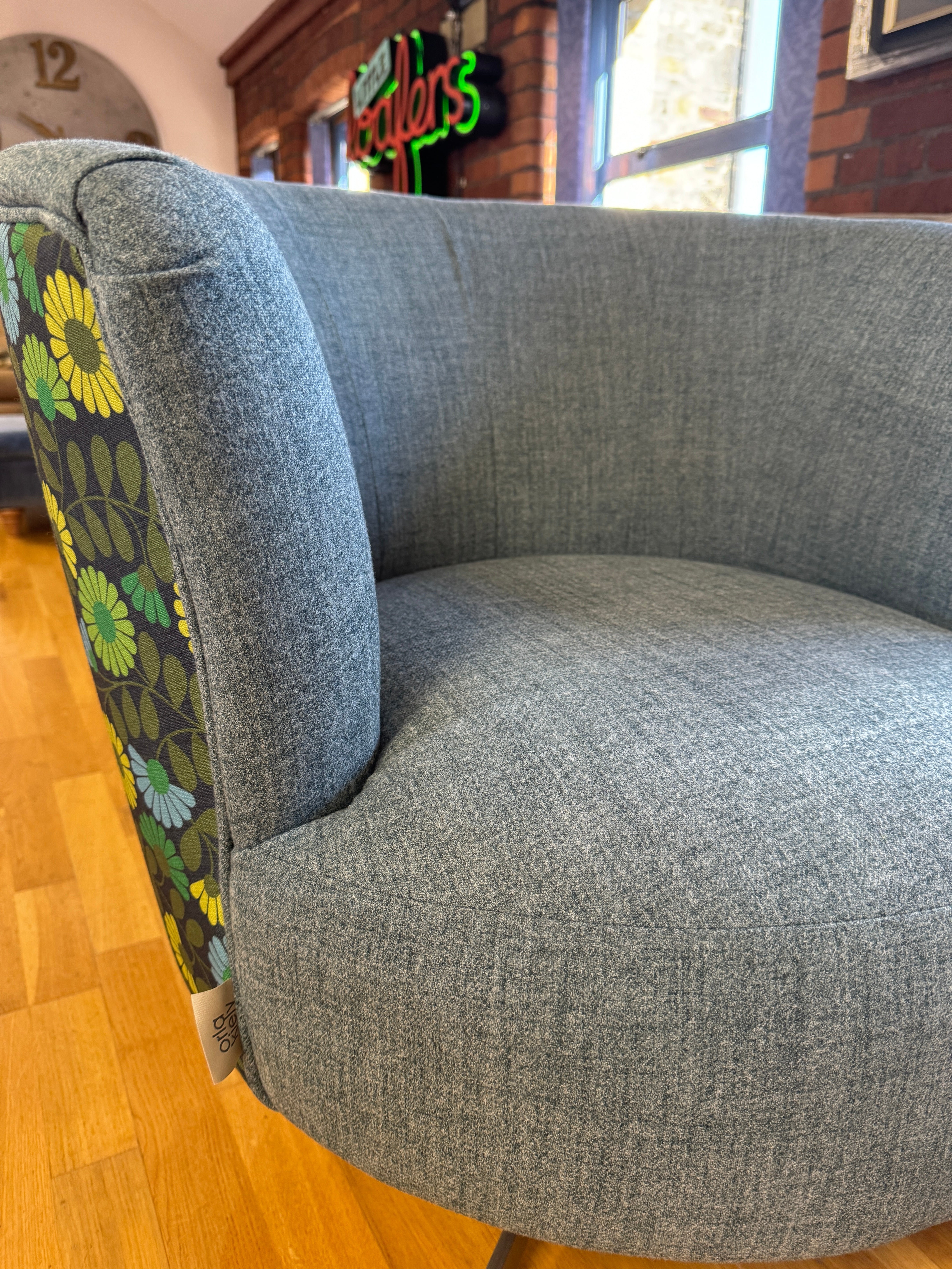 Lily swivel chair in teal and multi daisy print fabric