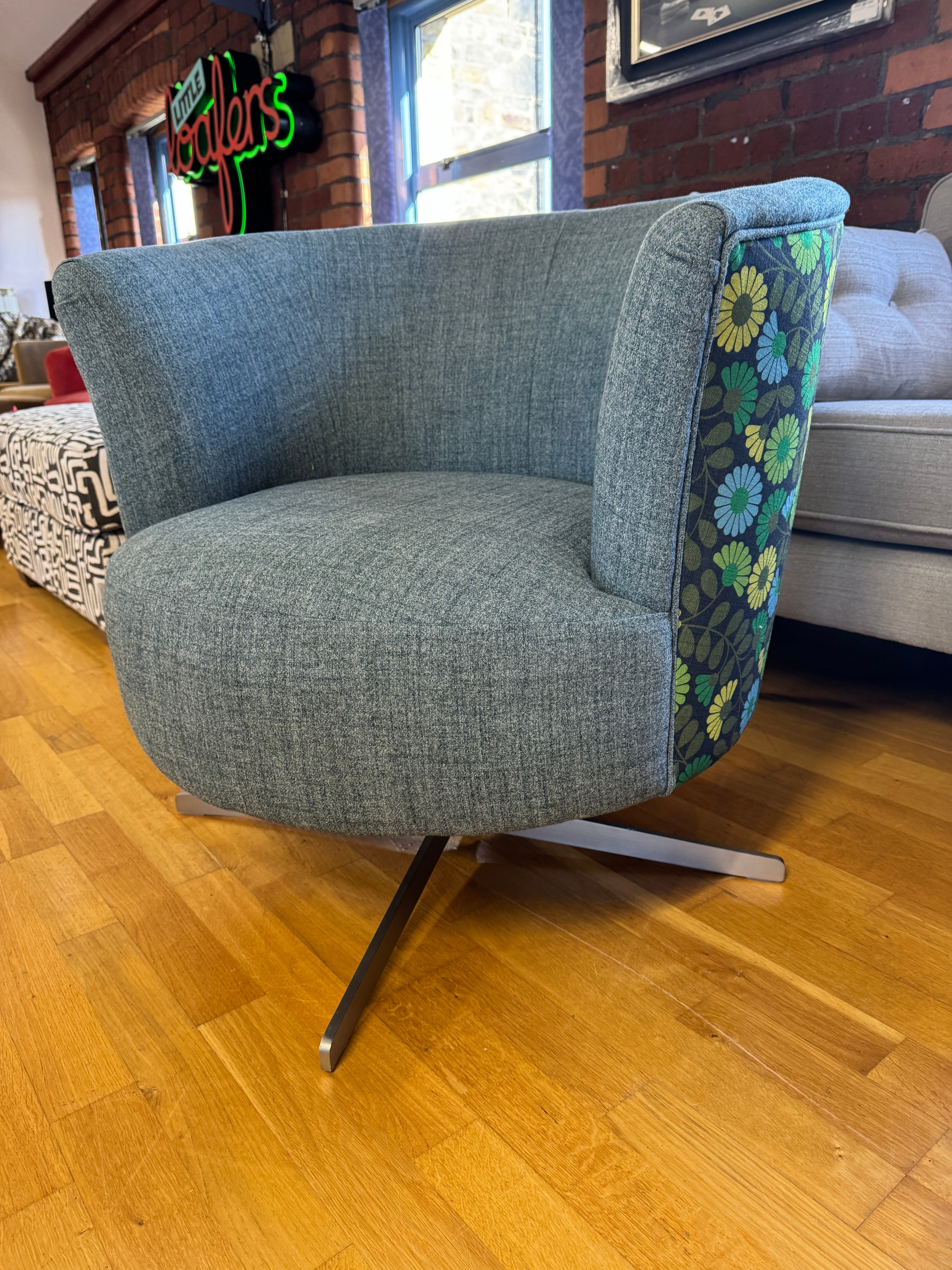 Lily swivel chair in teal and multi daisy print fabric