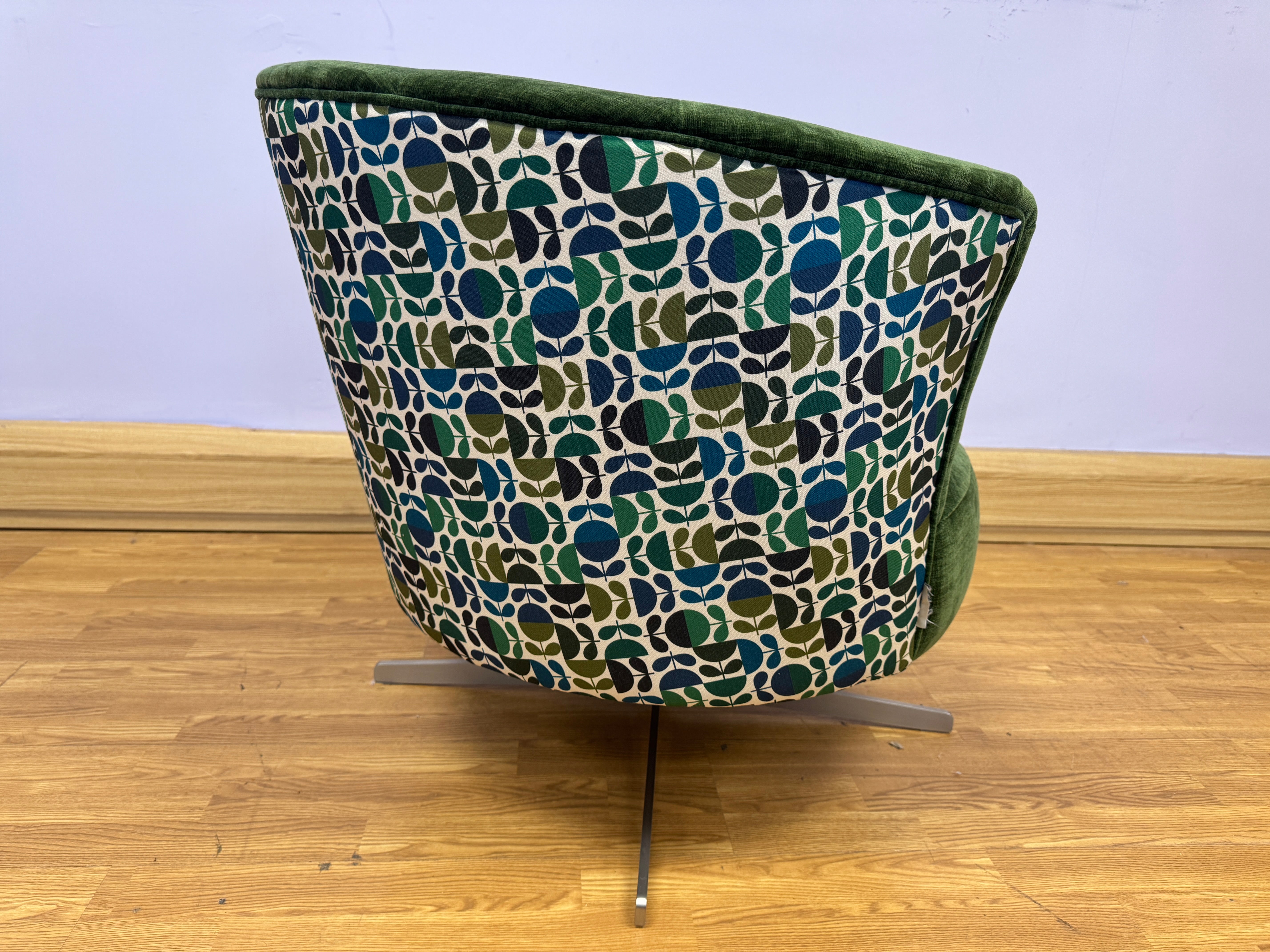 Orla Kiely Lily swivel base chair in Evergreen velvet with Jigsaw emerald navy back