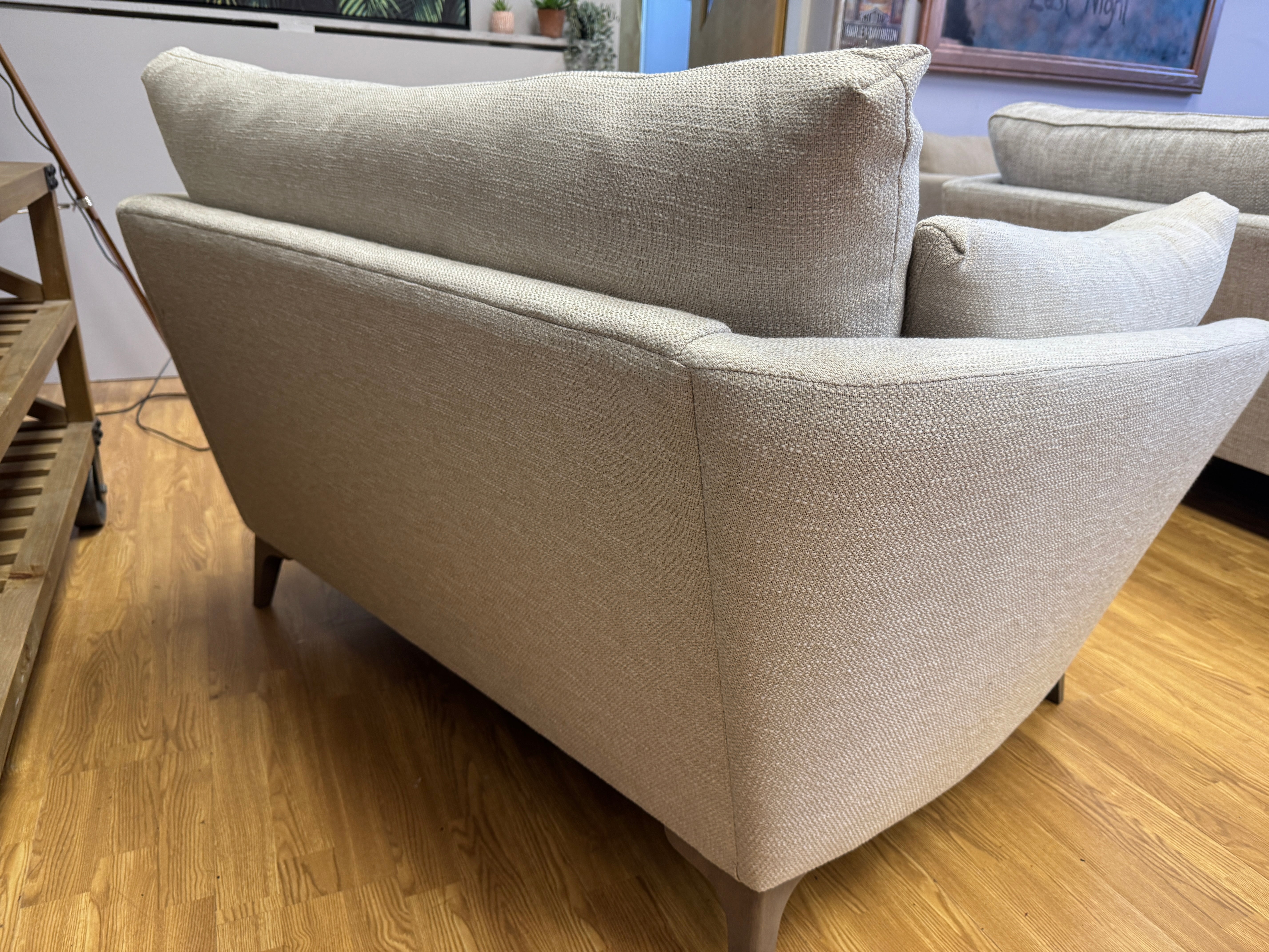 Elton curved sided loveseat in natural linen fabric