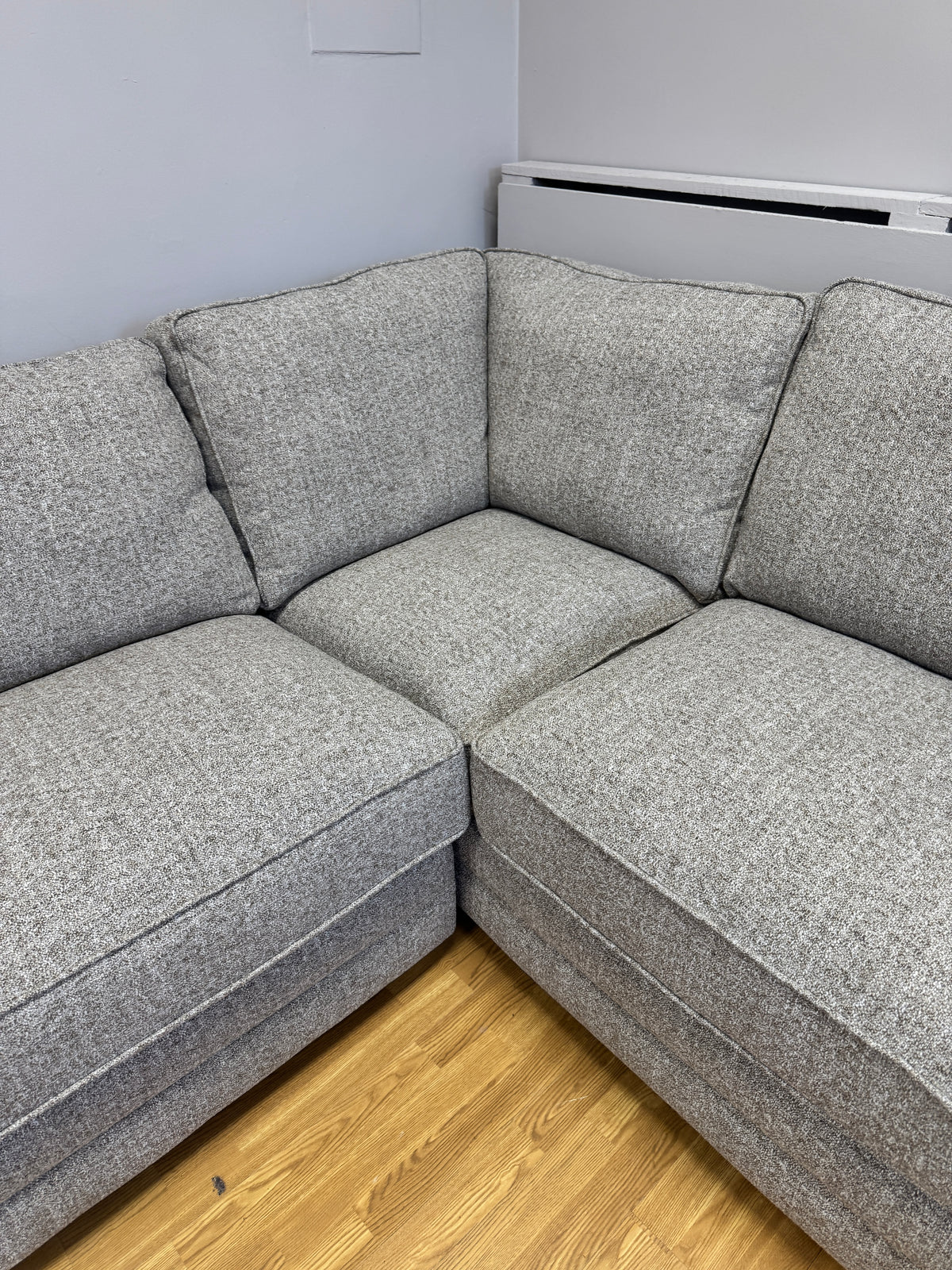 Proto right facing open corner sofa with footstool in Osaka Coppice fabric