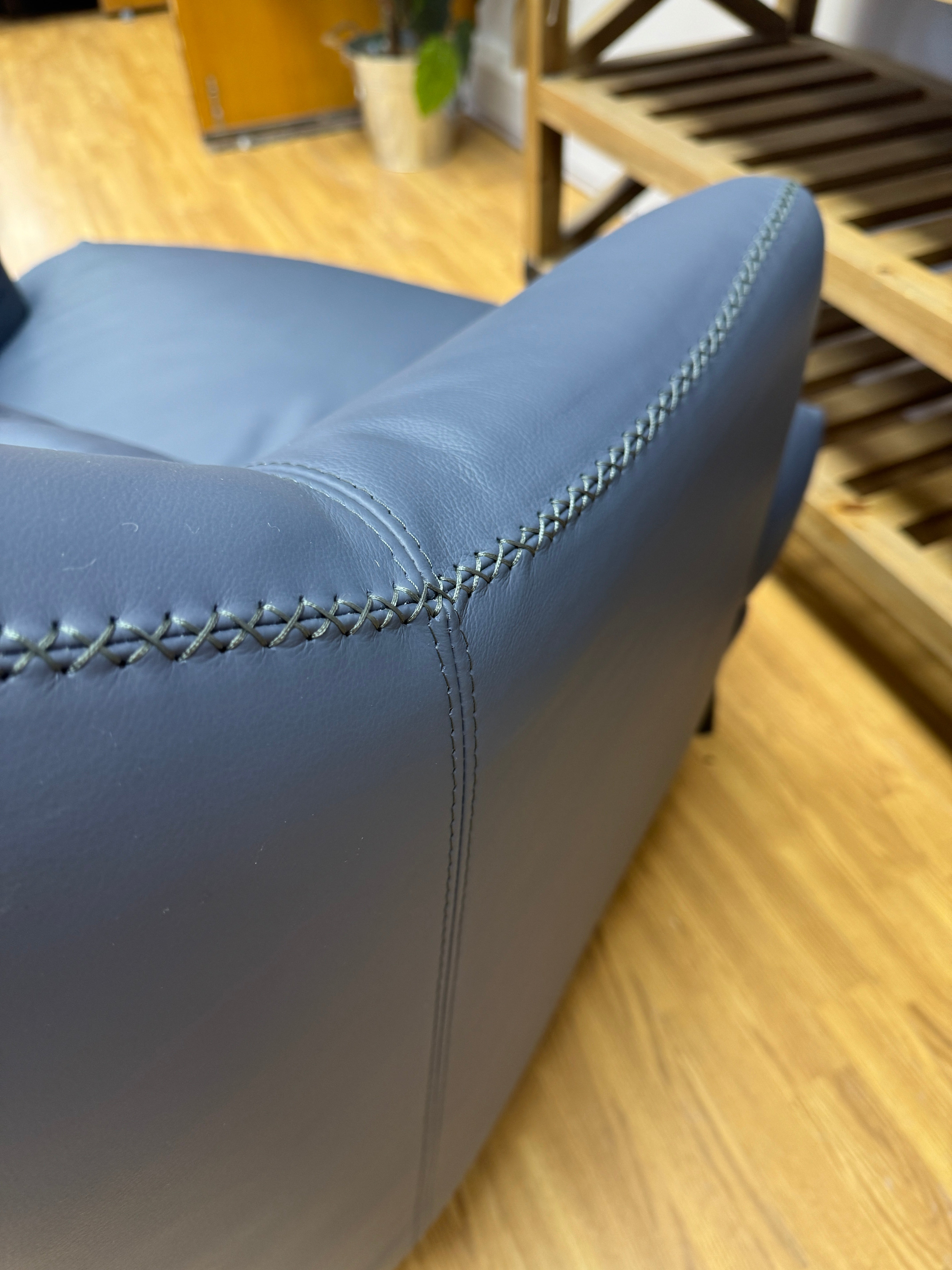 Kartik curved armchair in full blue leather