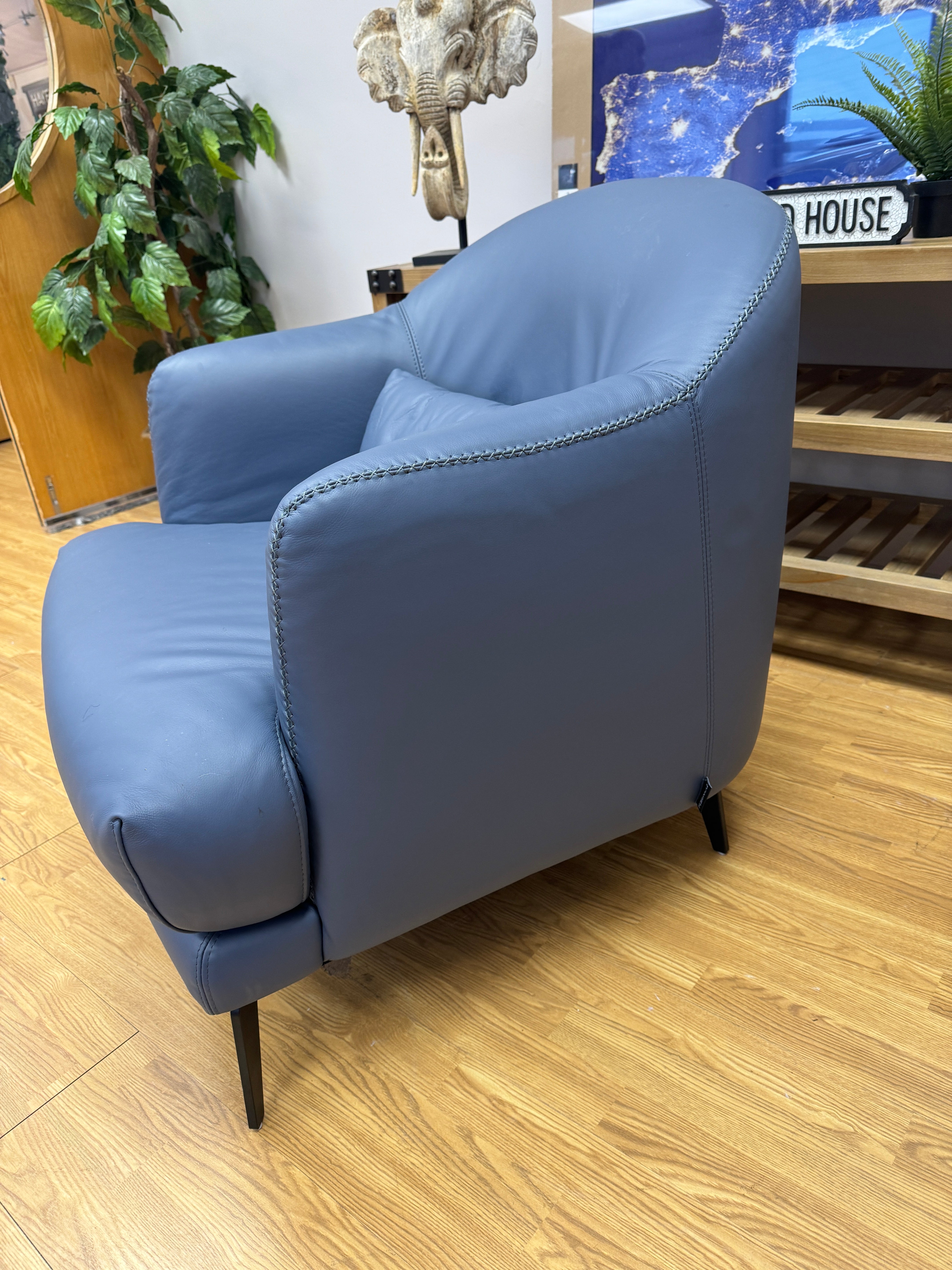 Kartik curved armchair in full blue leather