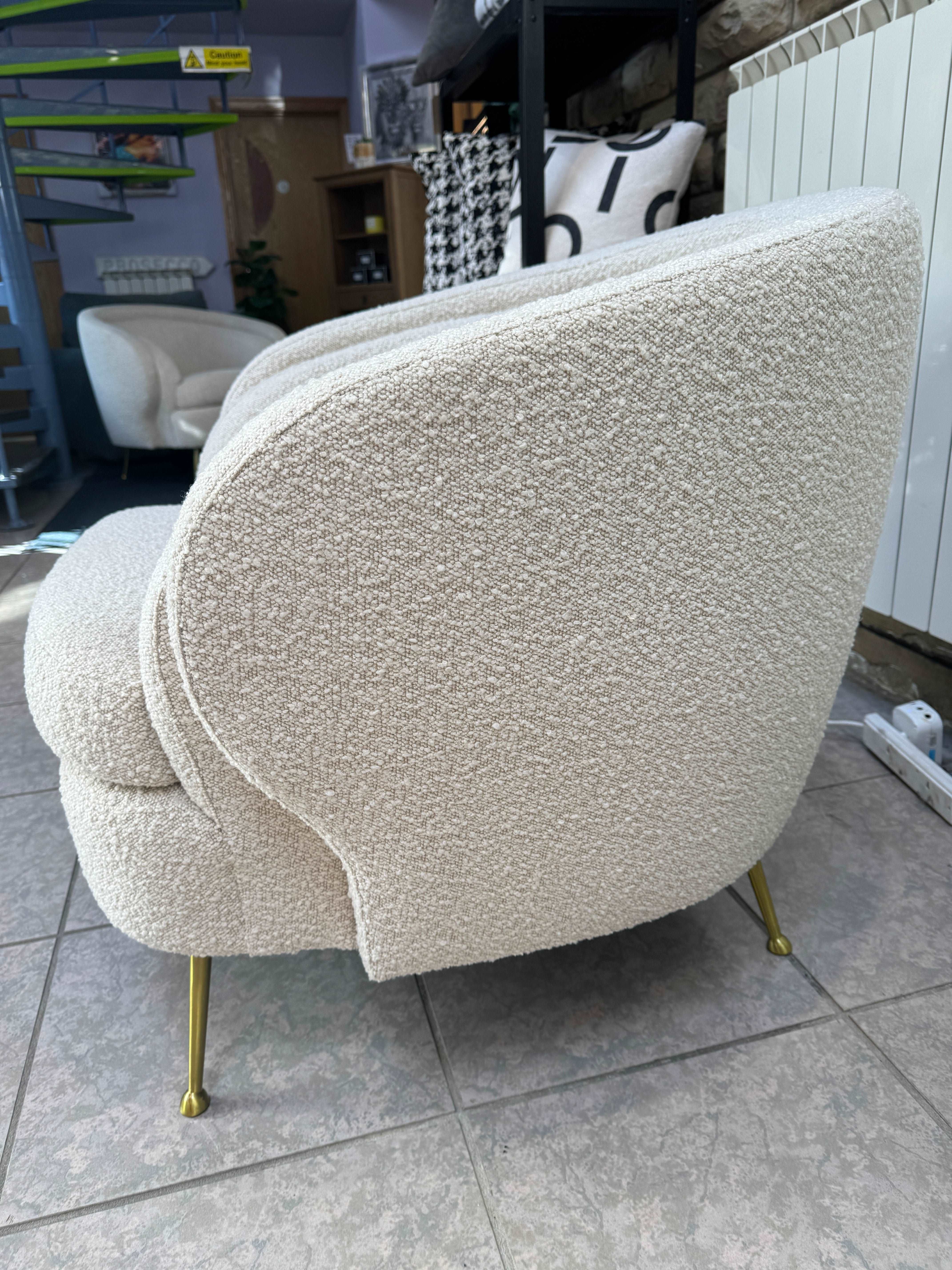 Eichholtz Orion curved back accent chair in cream boucle fabric