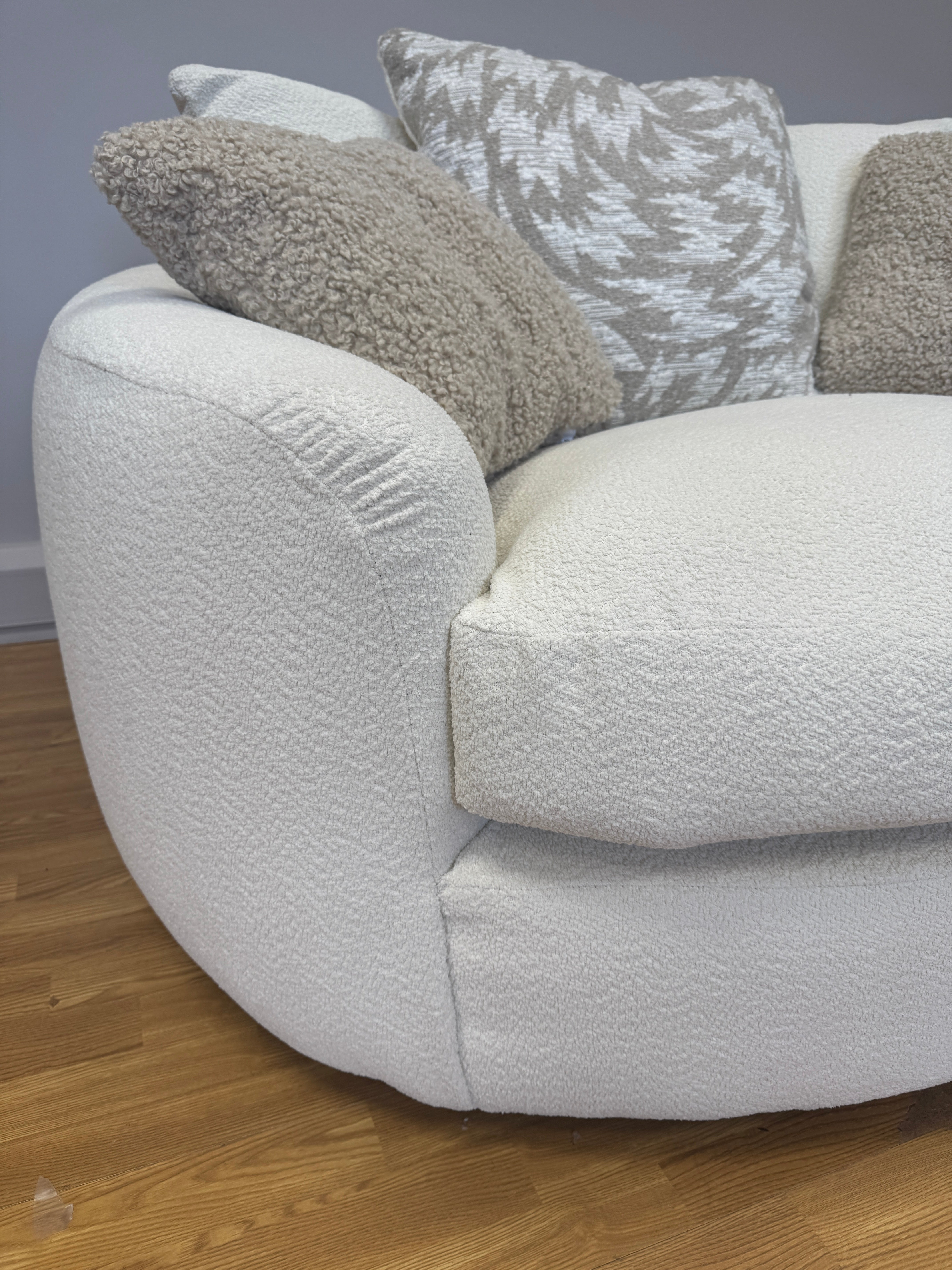 Logan curved sided swivel base loveseat in natural soft weave fabric