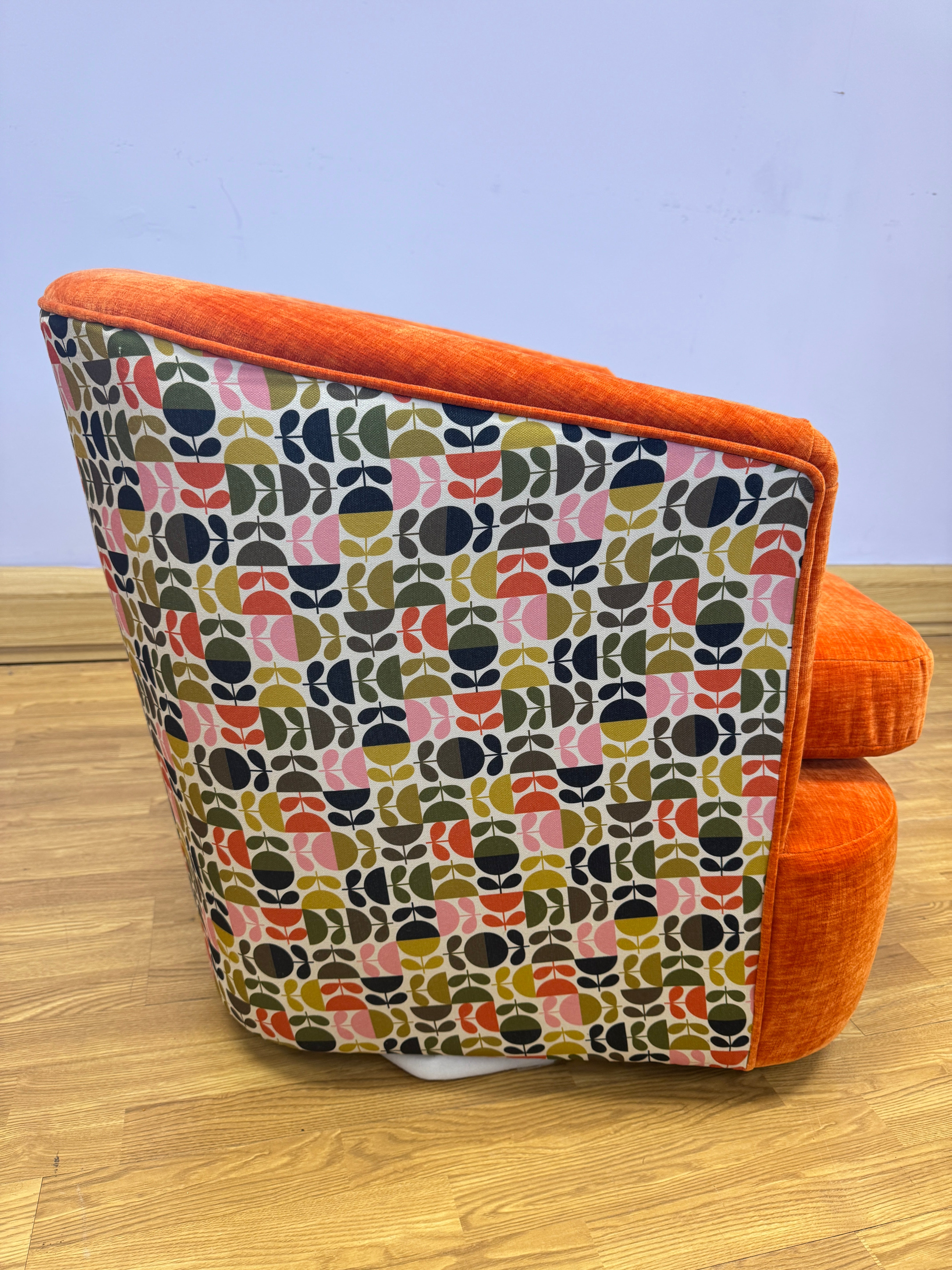 Orla Kiely Callan swivel base chair in Orange velvet with Jigsaw pink ochre back